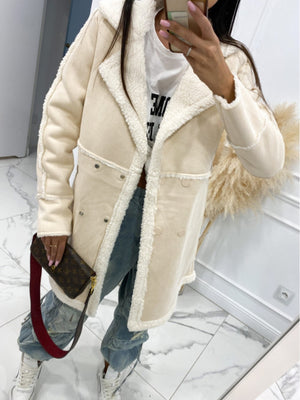 Cream suede effect overcoat with shearling trim and double-breasted closure.
