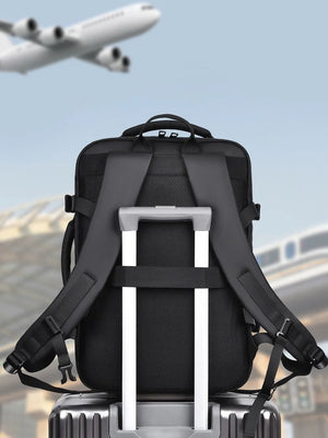 Black convertible commuter backpack with trolley strap and padded straps.