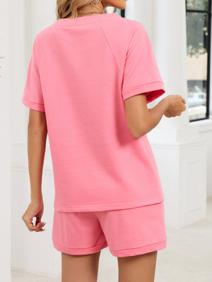Pink loungewear shorts and matching t-shirt with short sleeves and crew neck.