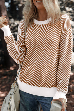 Chevron knit crewneck sweater in camel and white with white cuffs and hem.