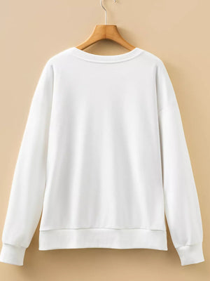 White crew neck sweatshirt with long sleeves and ribbed cuffs and hem.