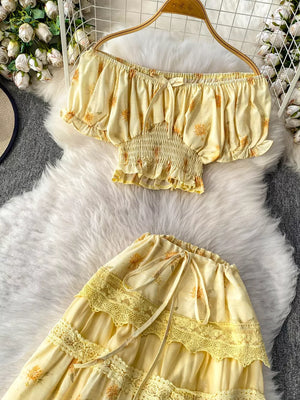 Yellow floral ruffled off-shoulder crop top and tiered lace skirt set with tie details.