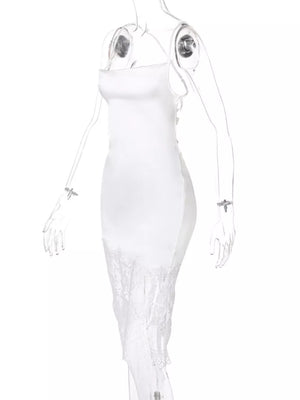 White satin slip dress with lace trim hem and spaghetti straps.