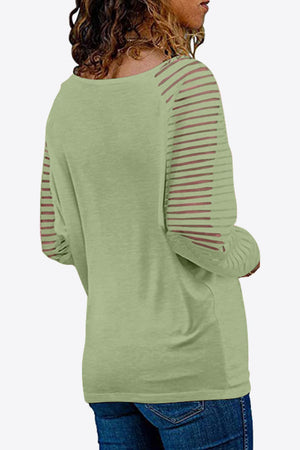 Mist Green raglan v-neck top with sheer striped sleeves.