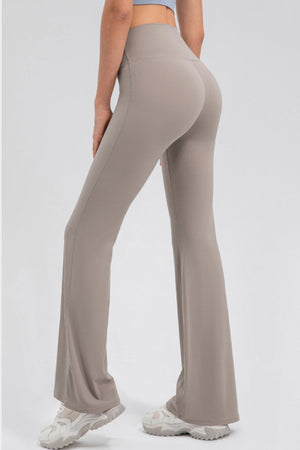 Tan sculpted flare leggings with a high waist and performance fit.