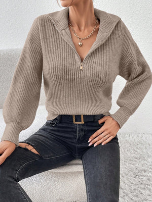 Taupe ribbed zip-up knit sweater with a wide collar and balloon sleeves.