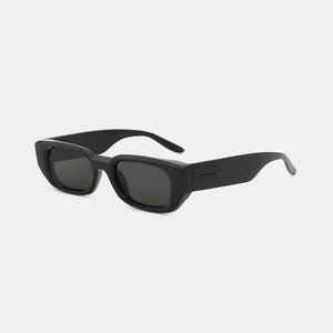 Black angular acetate sunglasses with thick frames and dark lenses.