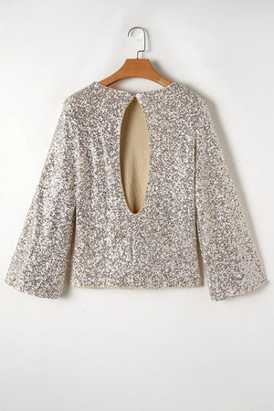 Ivory sequin blouson blouse with long bell sleeves and a large back cutout.
