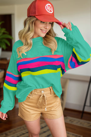 Turquoise crewneck sweatshirt with colorful horizontal stripes on chest and sleeves, ribbed cuffs.