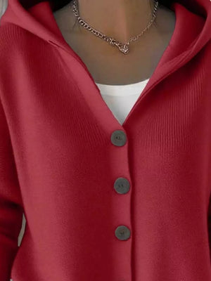 Burgundy button-front hooded knit cardigan with three visible buttons and a white tank top underneath.