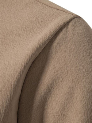 Men's plus-size casual button-up shirt in textured beige cotton.