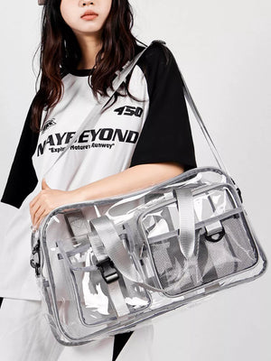 Sleek transparent travel duffel bag with grey accents and multiple pockets.