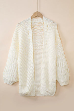 Textured knit cocoon cardigan in off-white with balloon sleeves and open front.