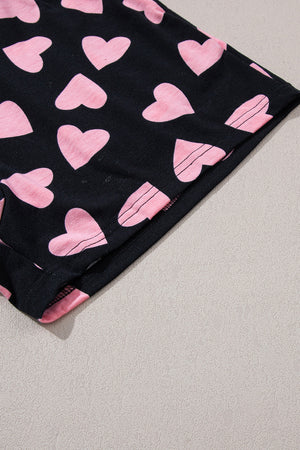 Black pajama shorts with pink heart print and pink trim detail