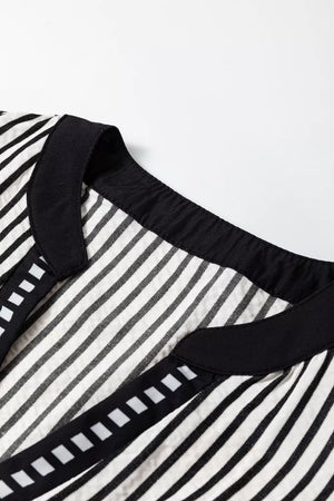 Chic black and white striped cotton midi dress with black trim and square detail.