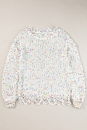 White confetti knit sweater with distressed hem and neckline.