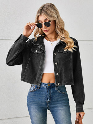 Black cropped denim trucker jacket with button front and chest pockets.