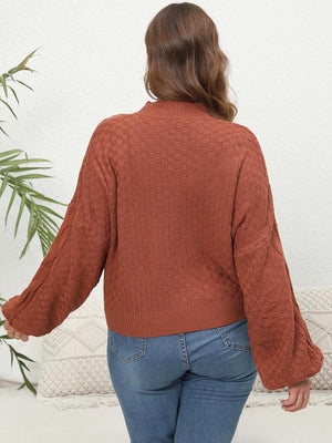Ochre textured cable knit sweater with balloon sleeves.
