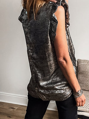 Elegant silver ruffled neck tank top with button back detail.