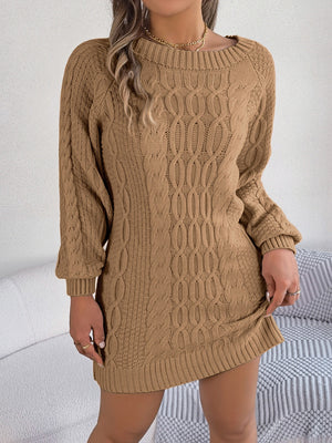 Camel cable knit mini dress with crew neck and long sleeves.