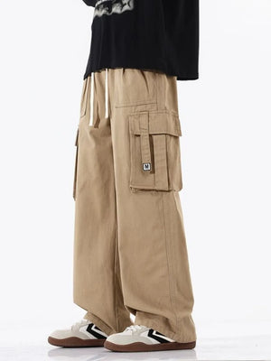 Khaki cotton cargo sweatpants with drawstring waist and multiple pockets.