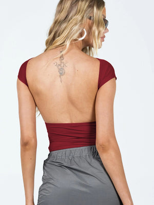 Deep Red backless cap sleeve crop top with a low back.