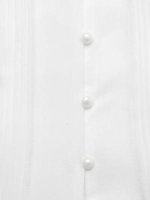 White midi dress with cap sleeves, pearl buttons, and pintuck detail.