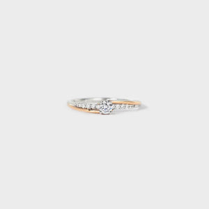 Silver dual band ring with diamond accents and a central stone.