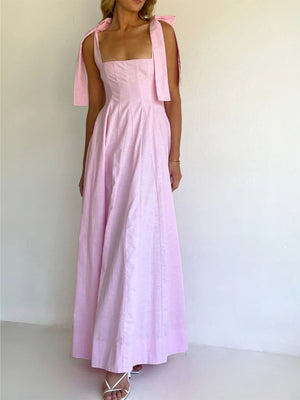 Pink maxi dress with square neckline and bow tie shoulder straps