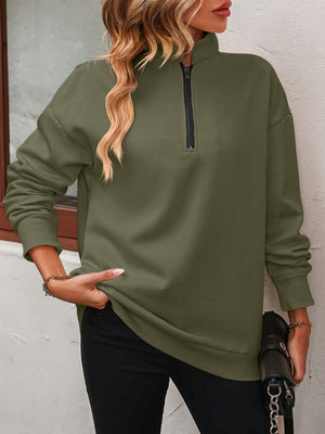 Army green quarter-zip relaxed fit sweatshirt with a mock neck and black zipper detail.