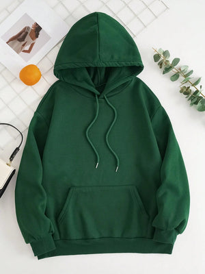 Dark green oversized hoodie with pouch pocket and drawstring hood.