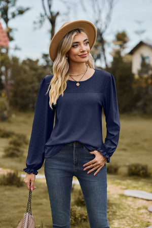 Dark Navy waffle knit blouse with perforated yoke and ruffled cuffs.