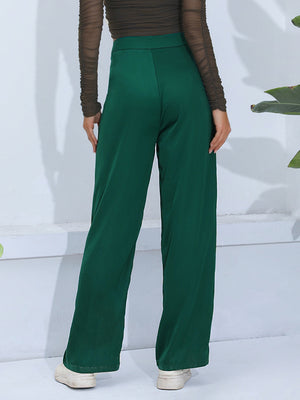Dark green wide-leg trousers with button detail, shown from the back.