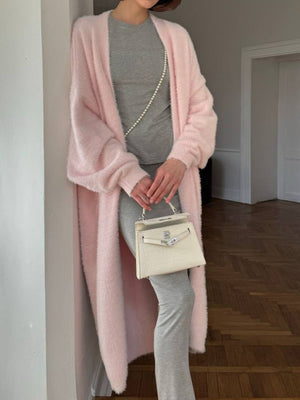 Plush pink maxi cardigan with balloon sleeves and open front, styled with grey basics.