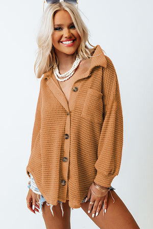 Caramel waffle knit button-down shirt jacket with a collar and chest pocket.