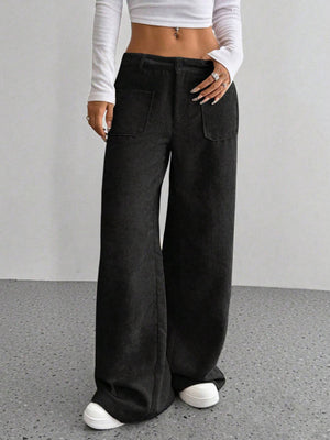 Black corduroy wide-leg utility trousers with front pockets and a relaxed fit.