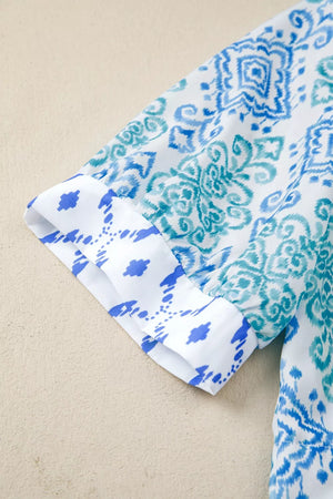 Patchwork babydoll shirt with puff sleeves in blue and white ikat print.