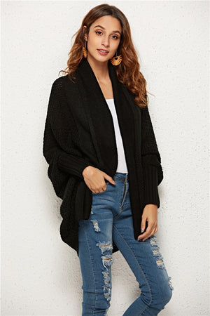 Black textured cocoon knit cardigan with batwing sleeves and shawl collar.
