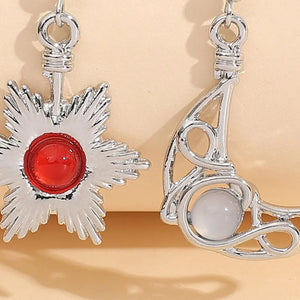 Celestial asymmetrical drop earrings in silver with red and white stones