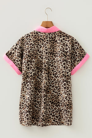Short sleeve button up shirt with leopard print and neon pink collar and cuffs.