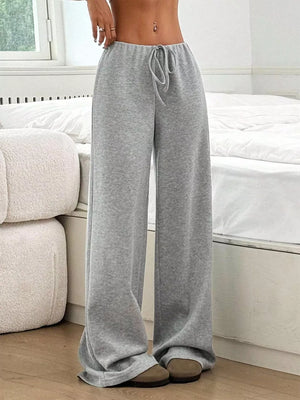Light Gray ribbed wide-leg pants with drawstring waist and relaxed fit.