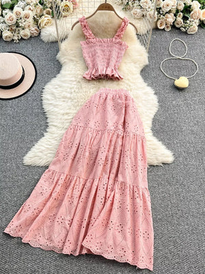 Pink ruffled crop top and eyelet maxi skirt set with elastic waistband.
