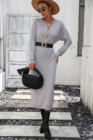Light gray textured knit henley midi dress with button detail and long sleeves.