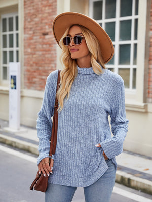 Misty Blue ribbed turtleneck sweater with side slits, long sleeves and relaxed fit.
