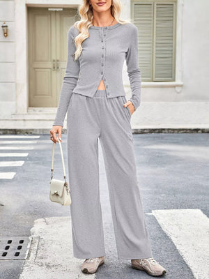 Gray button-up top and wide-leg pants set with crew neck and long sleeves.