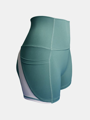 Teal colorblock pocketed sculpt shorts with white side panel detail.