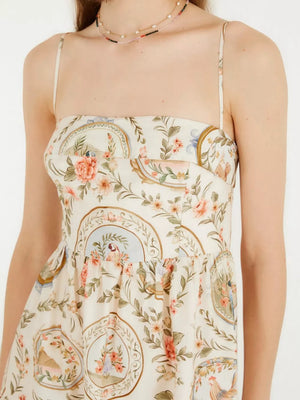 Vintage floral midi dress with spaghetti straps and a charming print of birds and flowers.