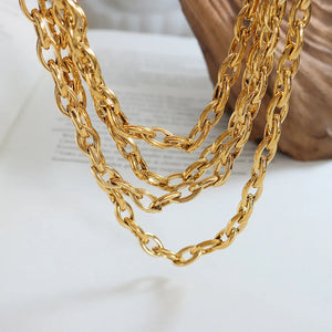 Chunky gold-tone oval link necklace with multiple strands.