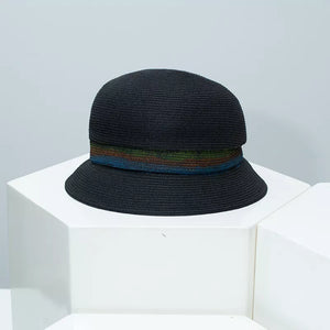 Black straw cloche hat with a vibrant striped band