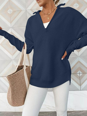 Navy ribbed knit pullover with funnel neck and quarter zip, long sleeves, relaxed fit.